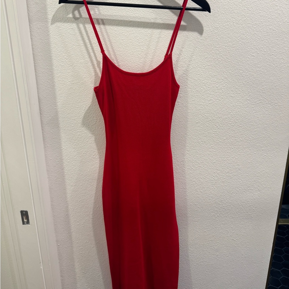 Red mid-length mini strap dress with slit